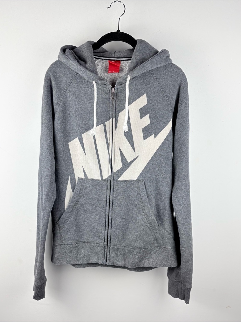 Men's grey zip-up hoodie with Nike label